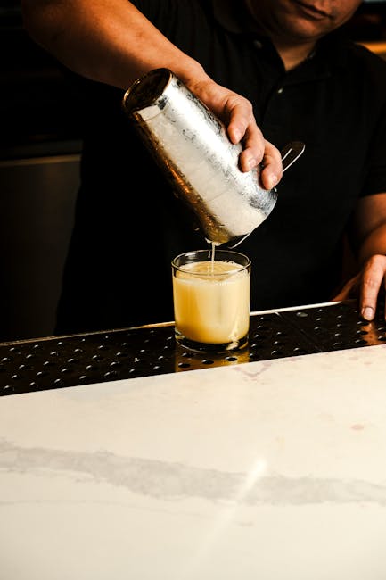 Professional staff serving refreshments at an elegant bar